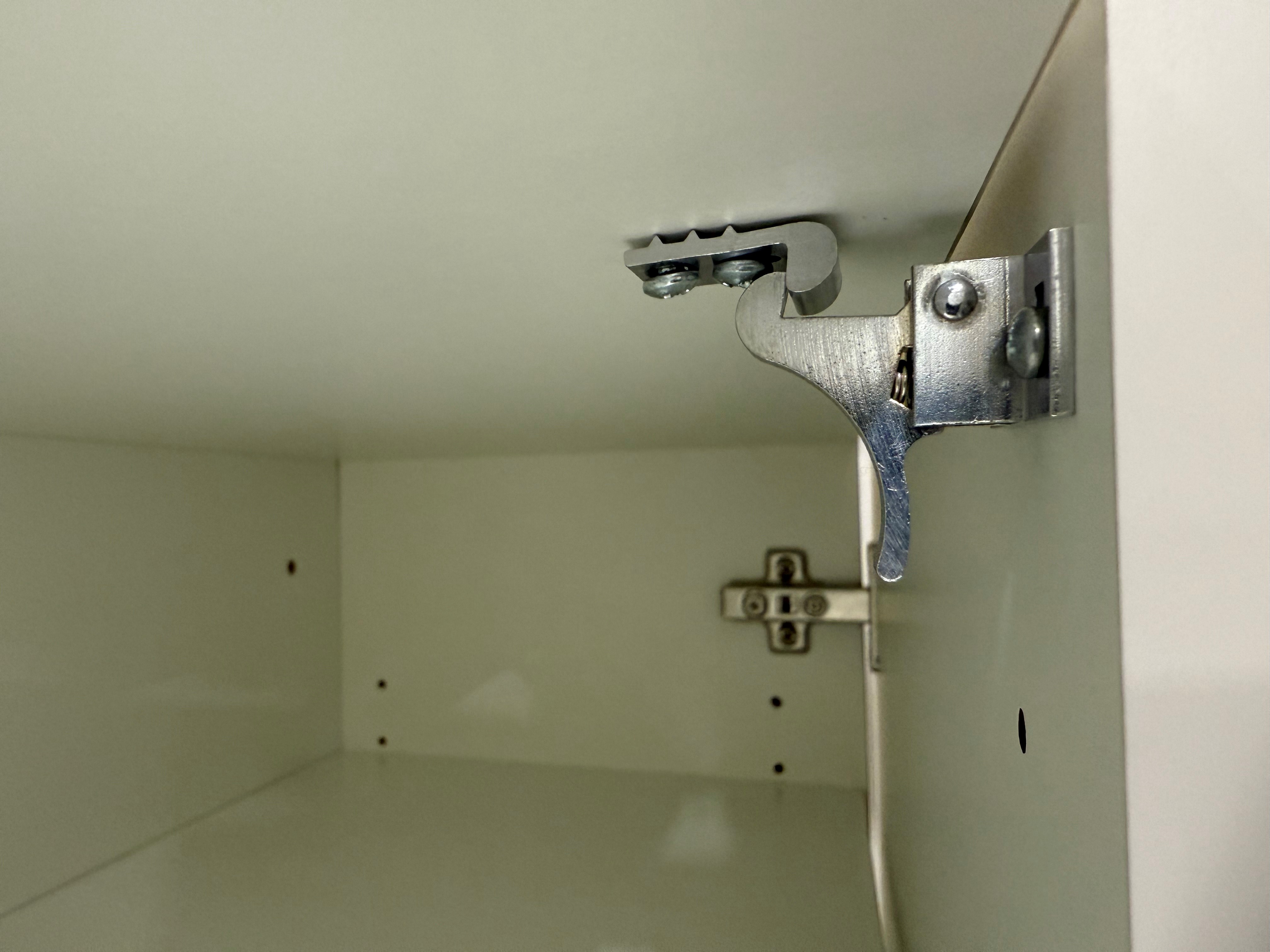Heavy duty elbow catch installation in commercial cabinet